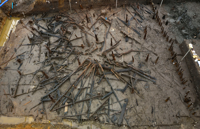 Image showing RH 1 before occupation deposits were exposed. The roof timbers seem to have retained their original position in a “fan” shape