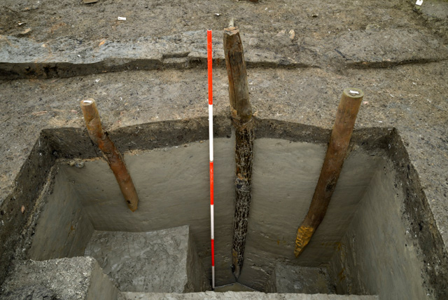 Image showing an investigative slot into the posts related to Roundhouse One. The largest post in the centre is oak and belongs to the outer ring of posts from the structure. 