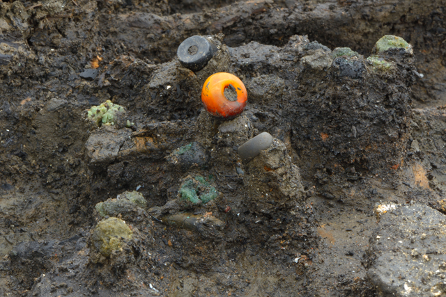 We’ve done our best to share the most interesting finds and discoveries from the site, such as the remains of this necklace, consisting of jet, amber and glass beads.