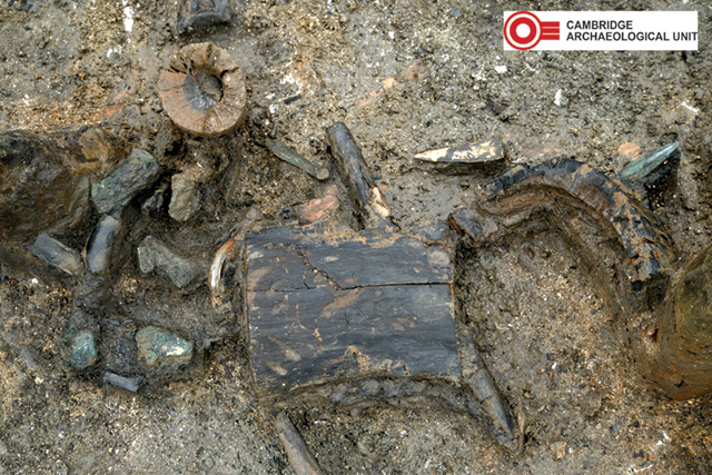 The charred remains of a wooden bucket